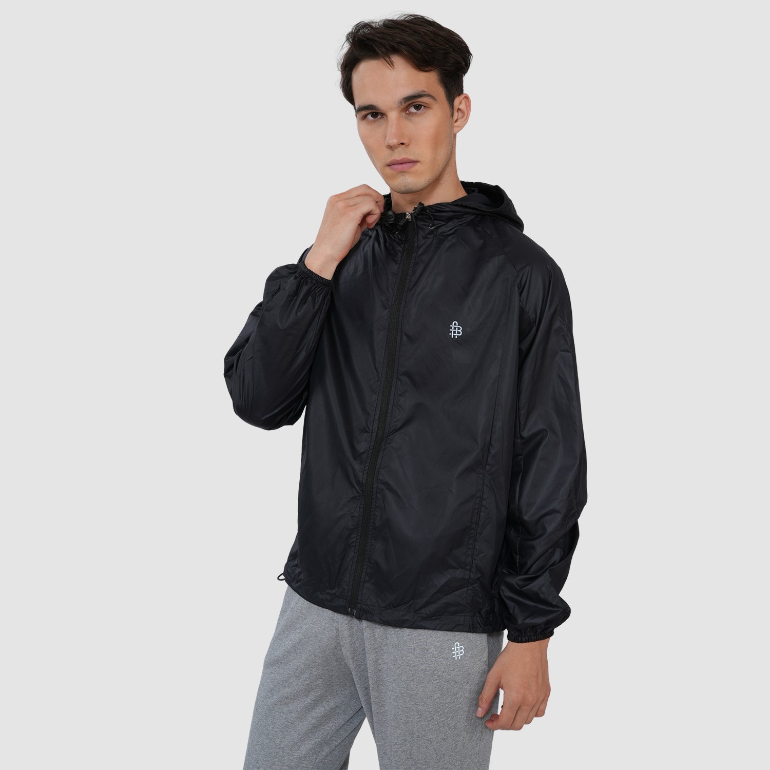 Model wearing a lightweight custom windbreaker jacket